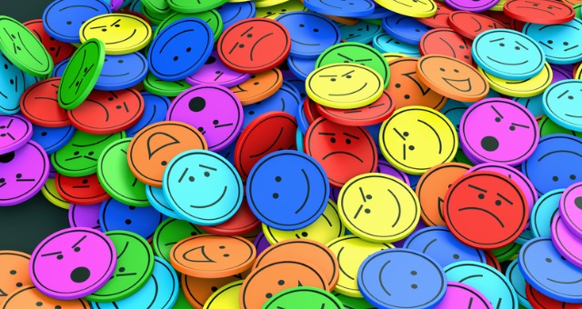 Different colored faces with different emotions and expressions